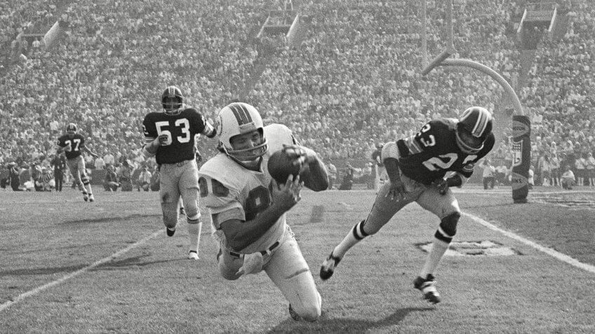 Jim Mandich; Harold McLinton; Brig Owens Miami Dolphins Jim Mandich makes a diving catch of a 19-yard Bob Griese pass near the goal line during the second quarter, setting up the Dolphins second touchdown in Super Bowl VII, in Los Angeles.