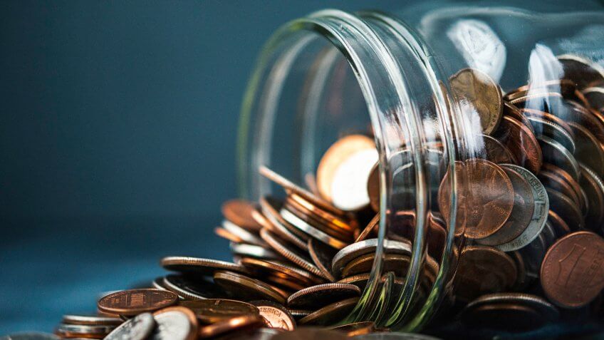 Money jar filled with American currency.