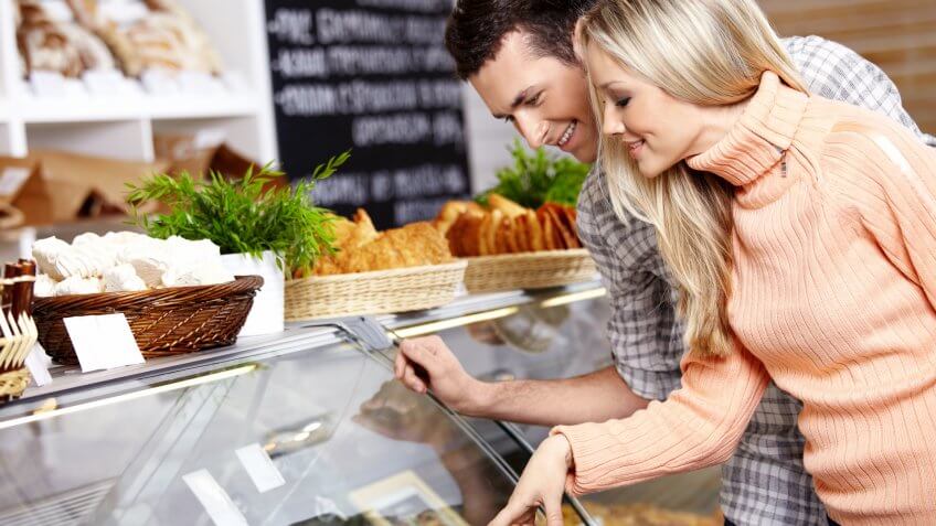 woman picking food at a grocery supermarket