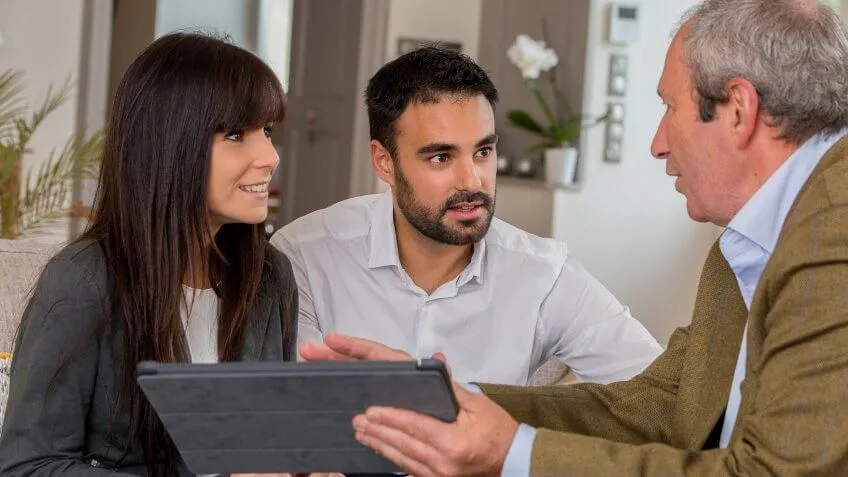 younger couple speaking to an adviser