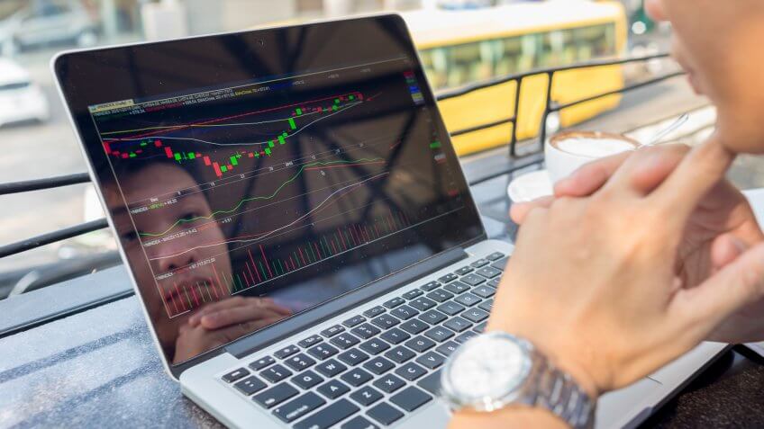 Investor watching the change of stock market on laptop.