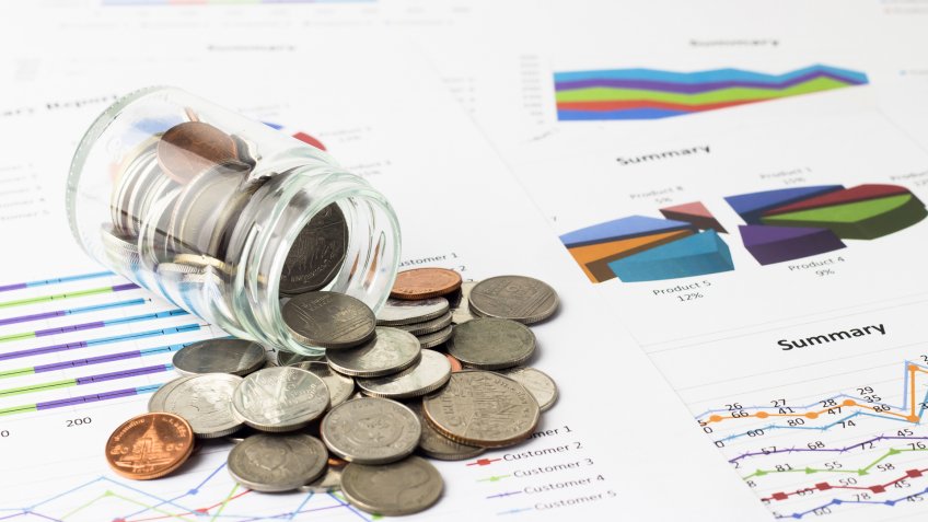 Money coins on business account in the background.
