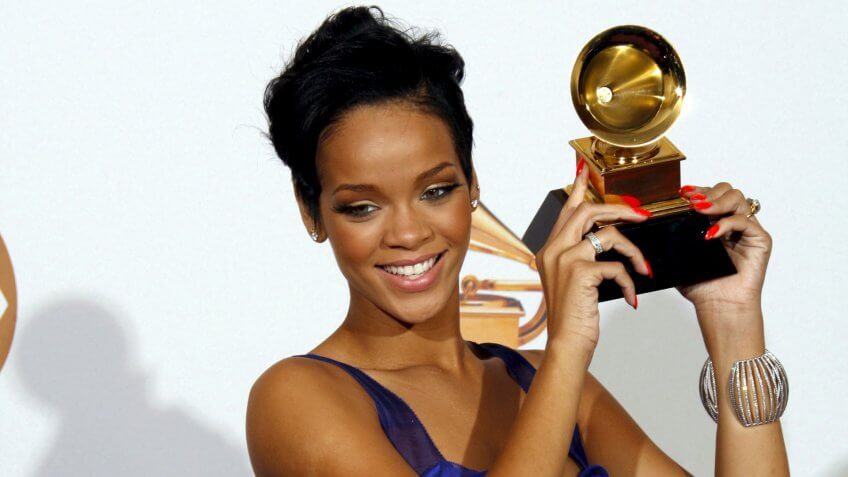 Mandatory Credit: Photo by Andrew Gombert/EPA/REX/Shutterstock (7832065ap)U S Singer Rihanna Holds Up Her Grammy Award During the 50th Annual Grammy Awards at the Staples Center in Los Angeles California Usa 10 February 2008Usa Grammy Awards - Feb 2008.