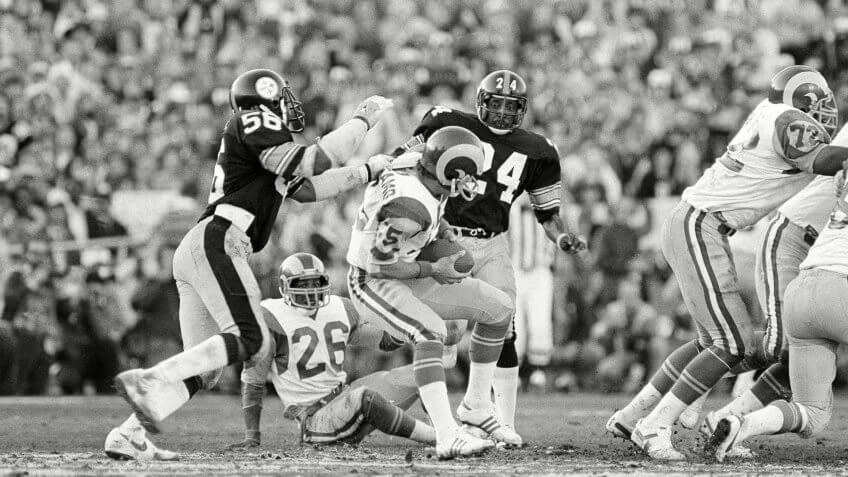 Robin Cole, Vince Ferragamo Rams quarterback Vince Ferragamo (15) prepares to pass but never gets the ball past Steelers' Robin Cole (56), during Super Bowl XIV action at the Rose Bowl in Pasadena, Calif.