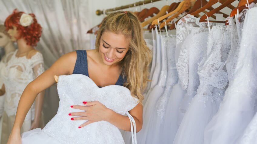 woman shopping for wedding gowns