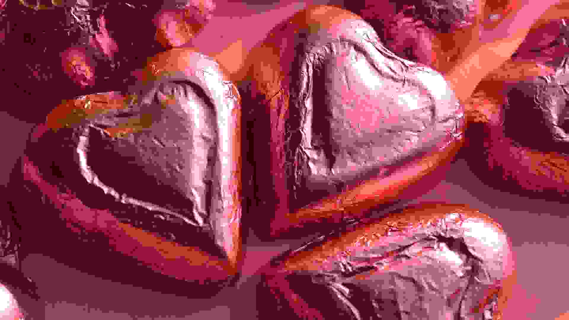 pink foil wrapped chocolate heart shape candy Valentine's Day.