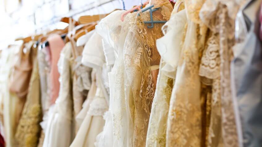 wedding dresses on a rack