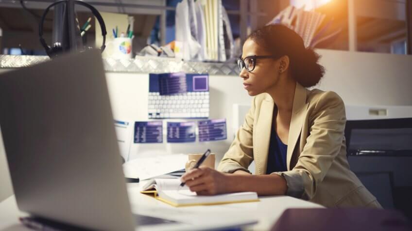 woman in her office cubicle working