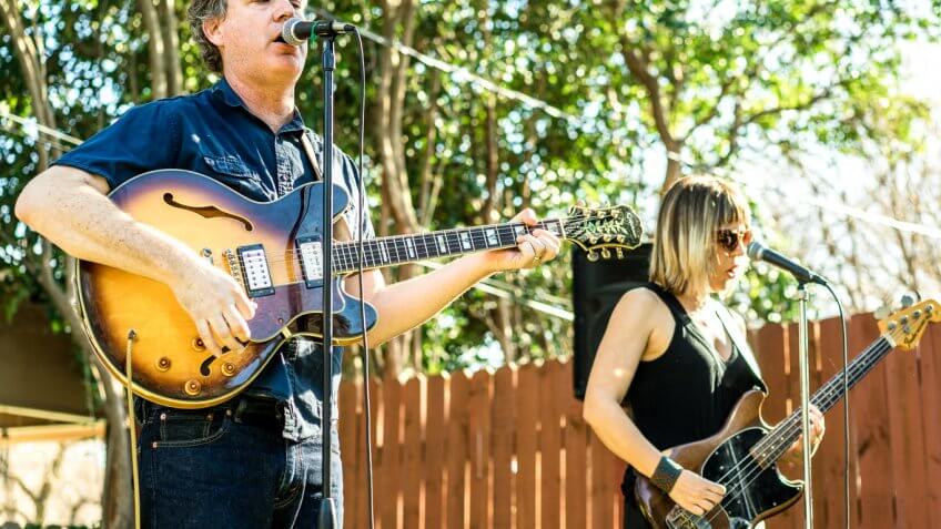 musicians singer guitarists performing outdoor