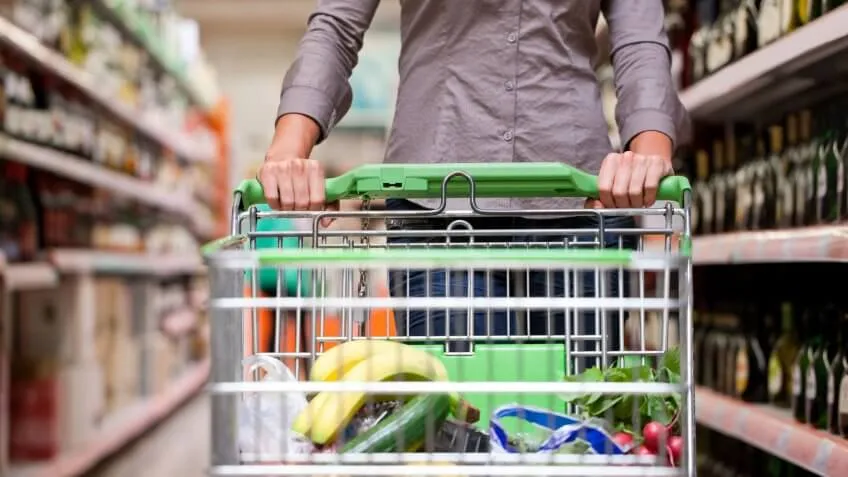 man pushing grocery cart