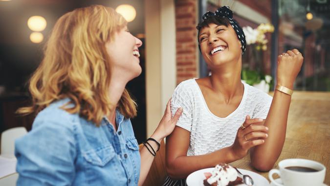 two women hanging out over coffee and cake