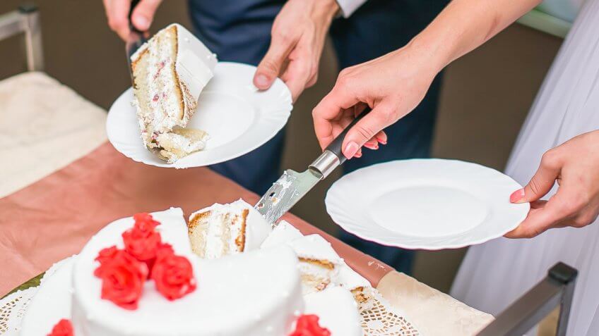 bride and groom cutting a small wedding cake