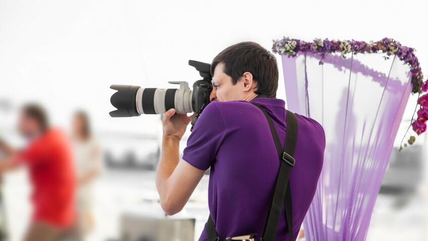 man photographing a wedding