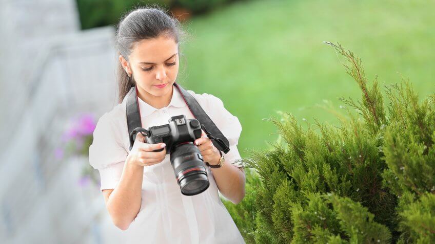young woman using a camera