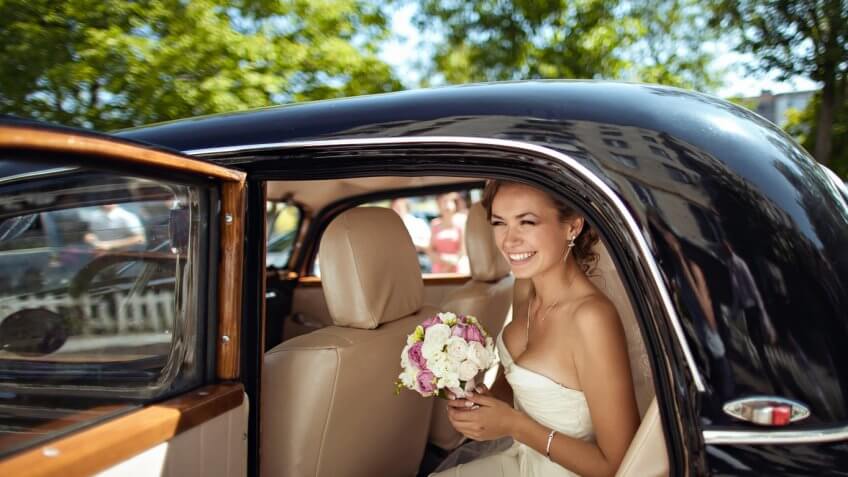 bride coming out of a car