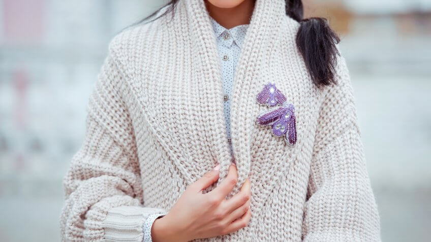 fashionable-young-woman-black-jeans-beige-cardigan