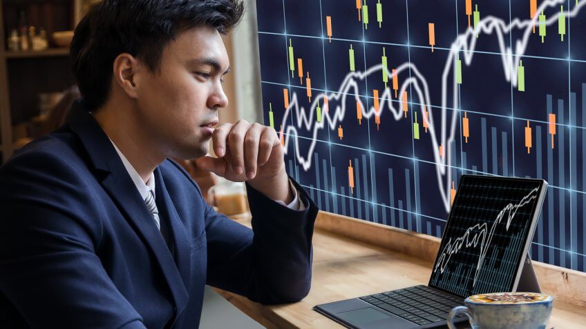 man looking at stocks