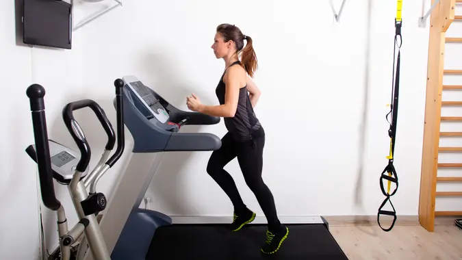 woman running on a treadmill in the gym