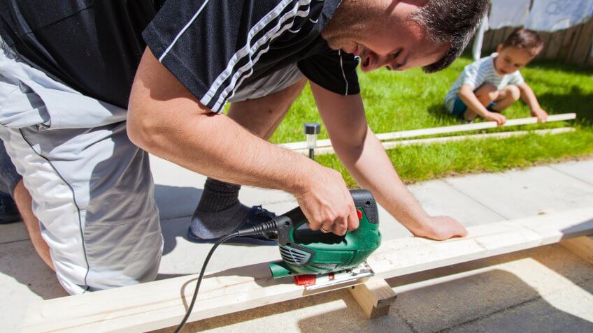 man with power tool working on home renovation