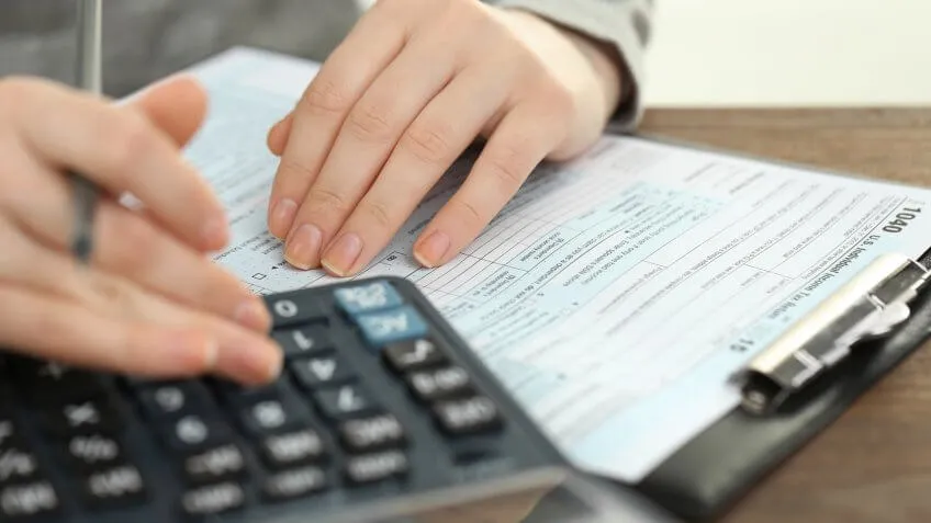 person filling out their 1040