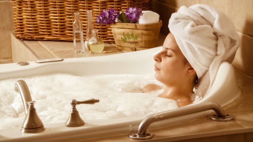 woman relaxing in a bubble bath