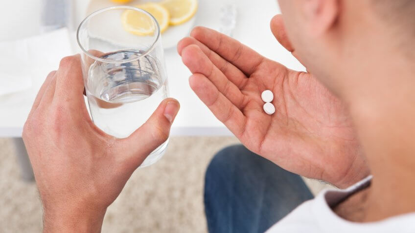 man taking medicine