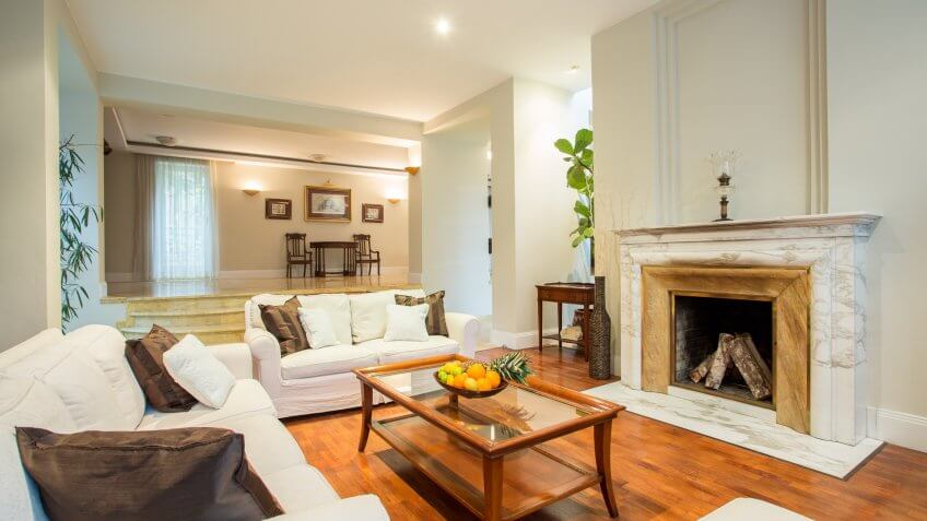 traditional living room with sofas and fireplace