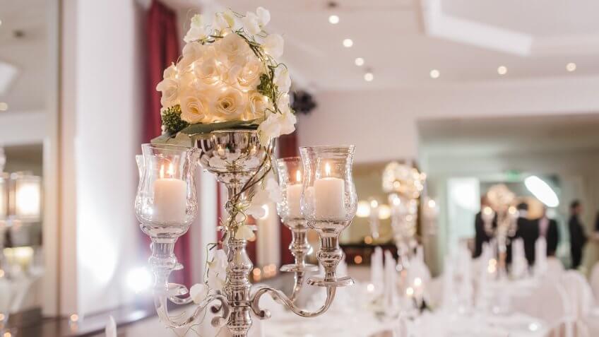 floral arrangement with candles at a wedding