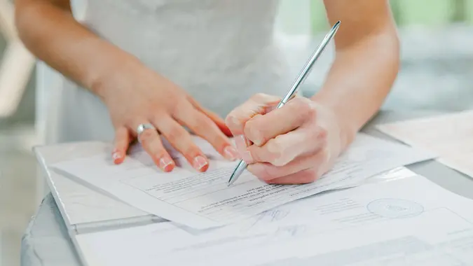 woman filling out paperwork