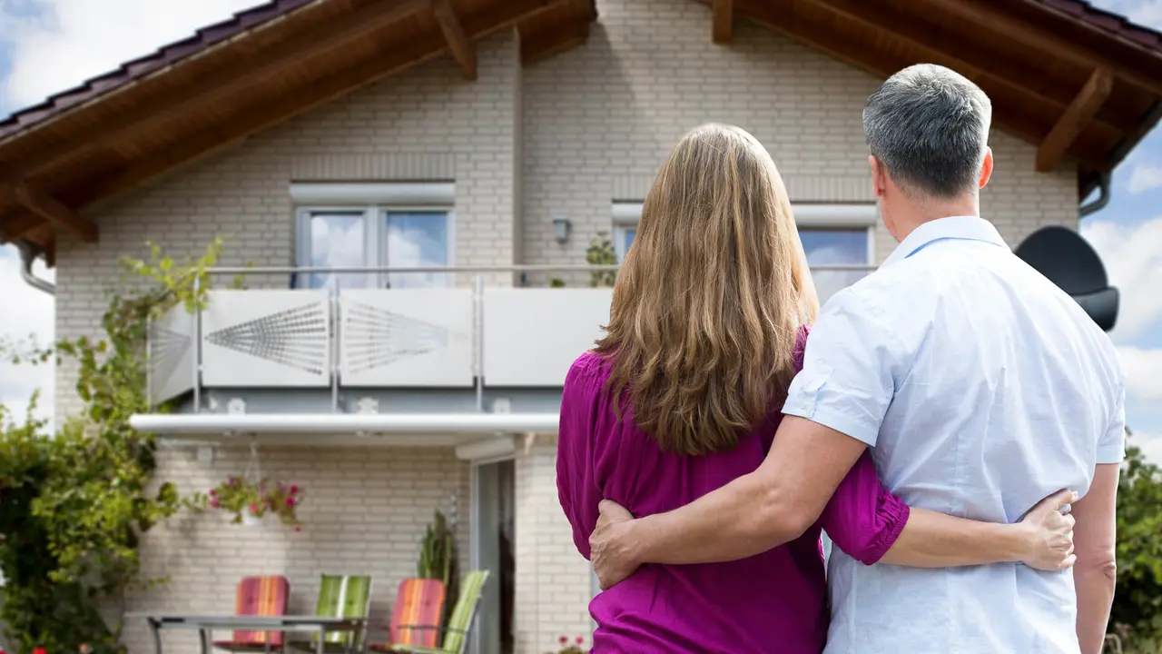 An older couple buying a home or weighing what would be suitable renovations.