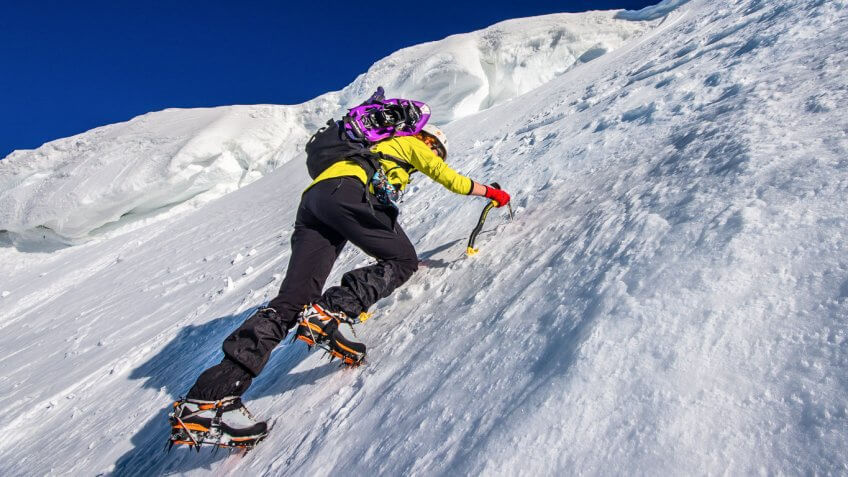 man ice picking up a mountain