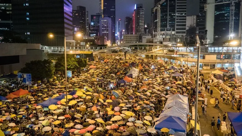 protesters crowding a city