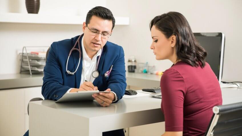 woman speaking to a doctor