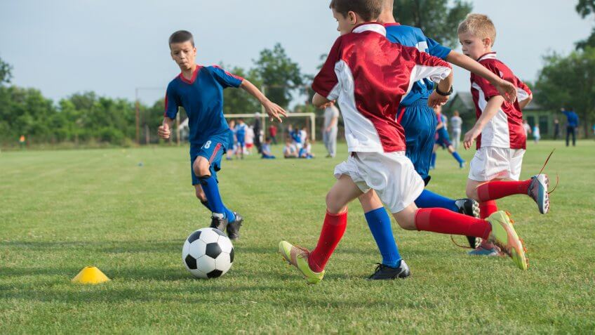 kids children playing soccer