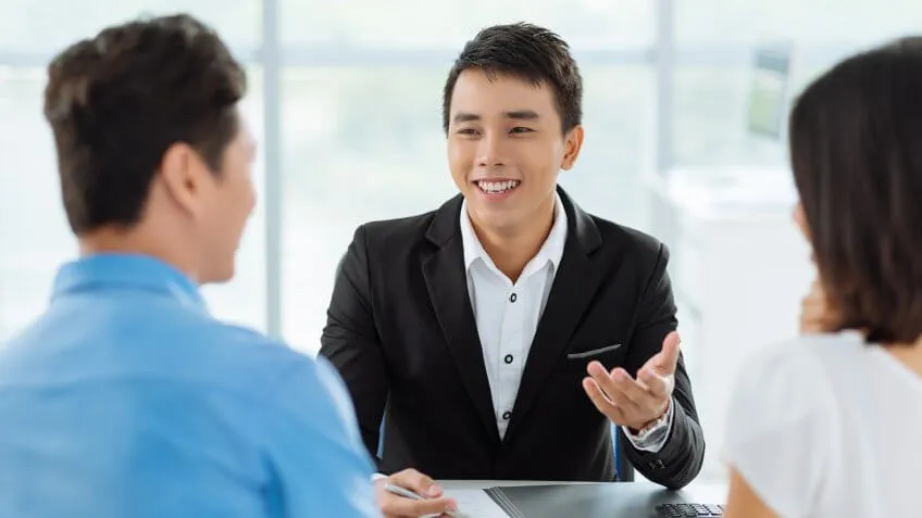 asian couple talking to a professional