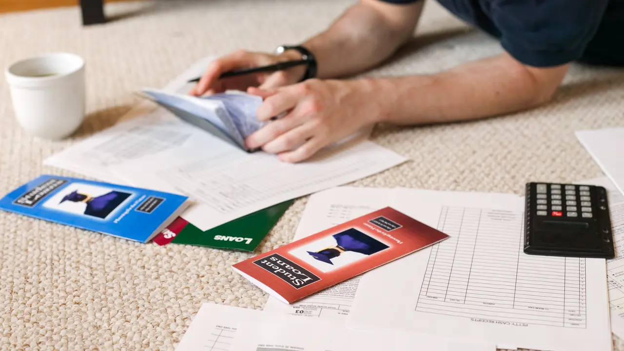 Man with checkbook and paperwork