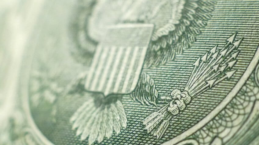 close up of US dollar bill eagle and arrows