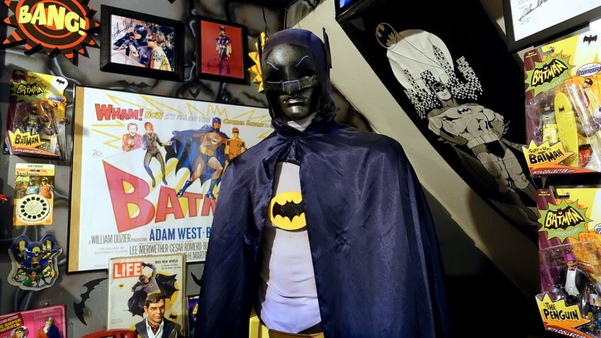 mannequin in batman costume with batman paraphernalia gear merchandise