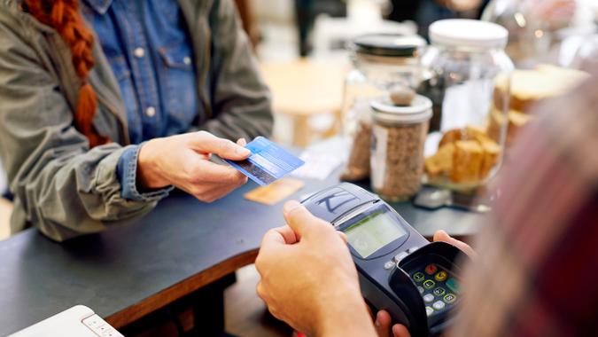 person using credit card
