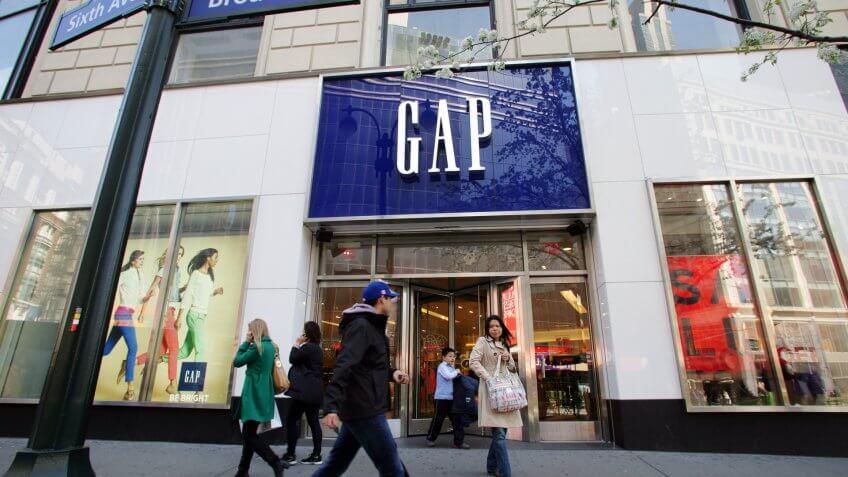 NEW YORK CITY - APRIL 19: Shoppers walk past a Gap retail outlet in New York City, on Friday, April 19, 2013.
