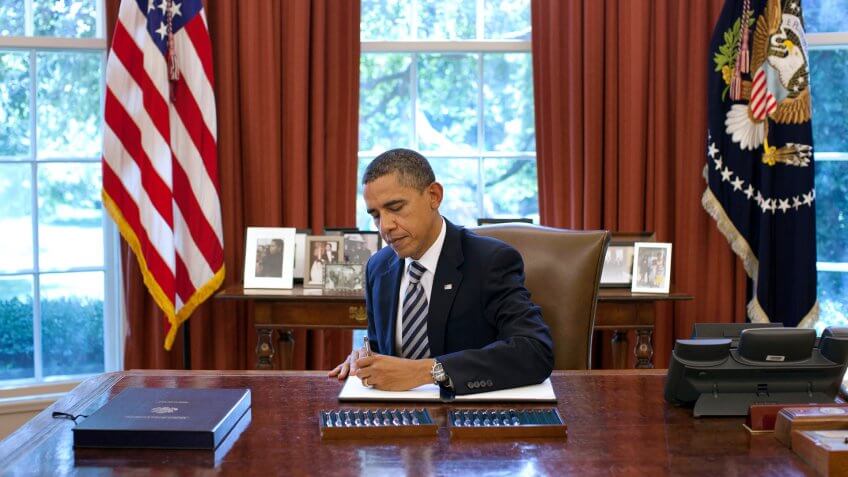 President Barack Obama signs the Budget Control Act of 2011 in the Oval Office, Aug.