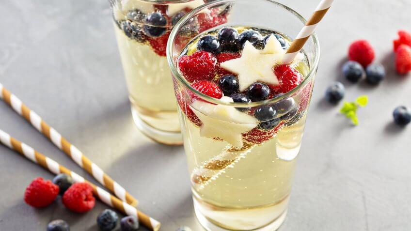 6 Red, White and Blue Batch Cocktails for Under $12, blue and white sangria with sparkling wine, red
