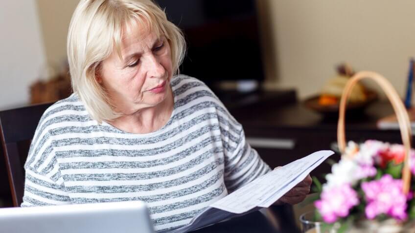 senior-woman-reviewing-earnings-record