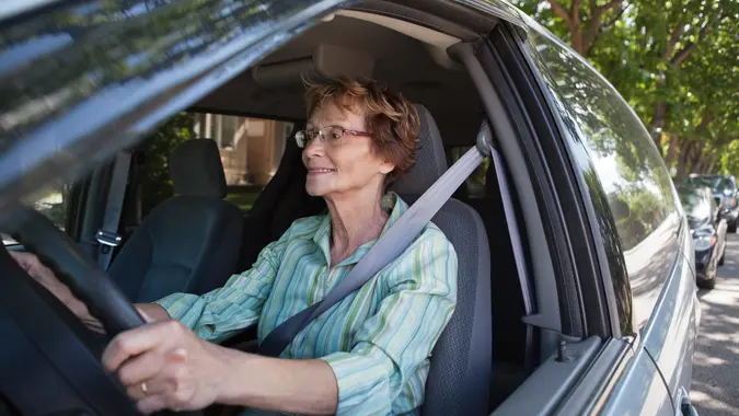 senior woman driving car
