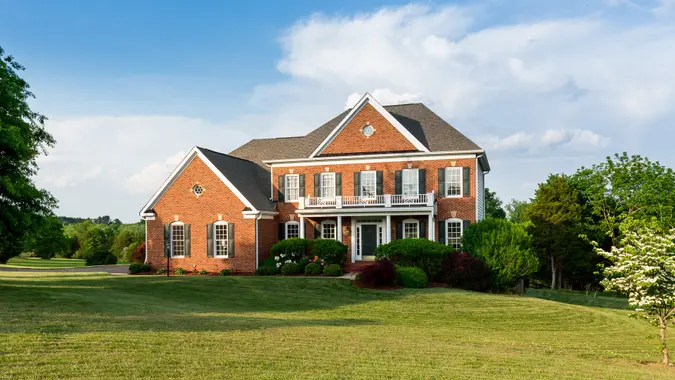 Architecture, Brick, Building Exterior, Built Structure, Detached House, Entrance, Facade, Front View, Front or Back Yard, Grass, Home Ownership, House, Housing Development, Landscaped, Large, Lawn, Luxury, Mansion, Modern, No People, Outdoors, Porch, Residential Building, Residential District, Single Family, Suburb, Summer, Tree, USA, Wide