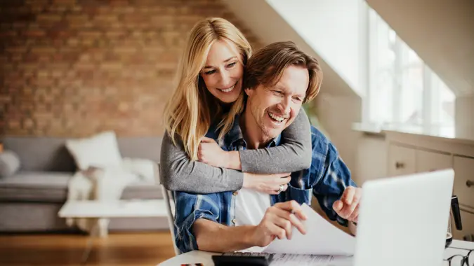 Photo of a mature couple calculating home finances.