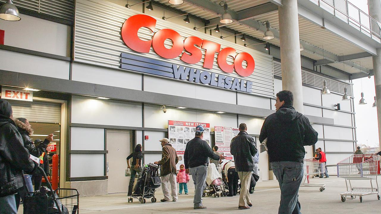 NEW YORK - NOVEMBER 13:  Shoppers enter a recently opened Costco warehouse store on November 13, 2009 in New York City.