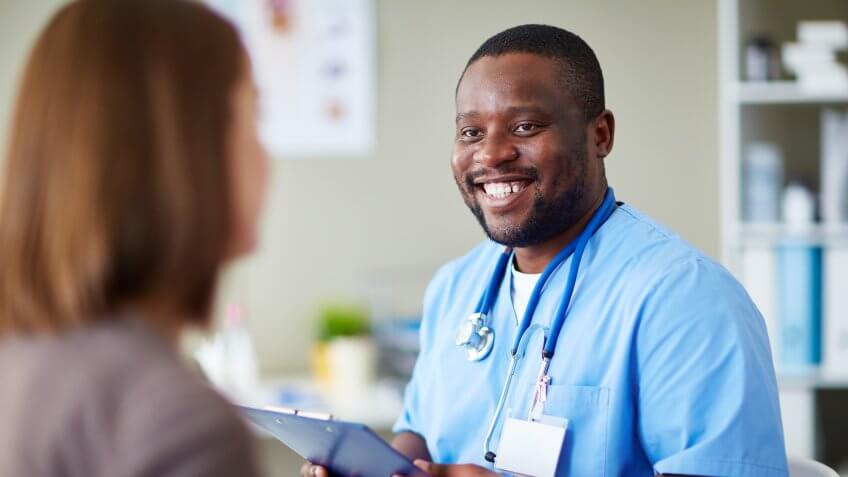 11214, Adult, African Descent, Clinic, Clipboard, Communication, Doctor, General Practitioner, Healthcare And Medicine, Holding, Horizontal, Hospital, Men, Nurse, Patient, Professional Occupation, Smiling, Stethoscope, Uniform, Working, jobs, medicine, people