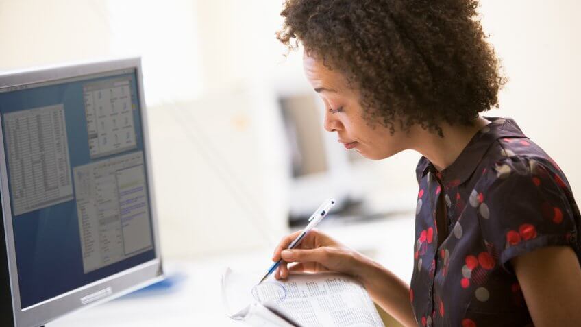 20s, Business Concepts, Business Ideas, Business People, Concept, Half Length, Handheld, Idea, Ideas, Indoors, Looking at Camera, One Woman, PC, Portrait, Recruitment, Seated, Smile, Twenties, Vertical, Woman, Work, Worker, Working, advertisments, adverts, african american, businesswoman, career, circling, day, desk, employment, job, job hunting, job seeking, newspaper, office, one person, online, reading, sitting, smiling, vacancies, vacancy, young adult, young woman, 22 Industries That Pay Less (and More) Than They Did 10 Years Ag, Business