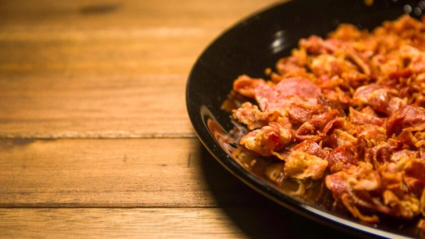 Bacon bits on black dish in Wood background., Things that are always cheaper at Costco